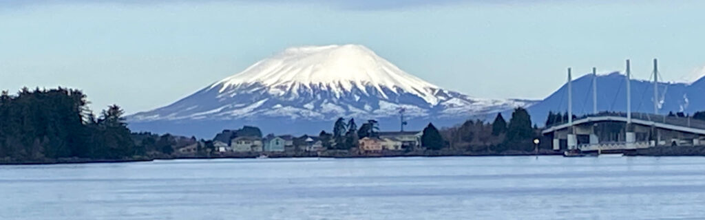 A stunning view of Mount Edgecumbe and the community of Sitka, Alaska in Spring 2023. Photo by Shauna Potocky. 